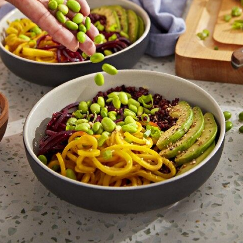Bowls with veggie noodles, edamame, avocado and quinoa