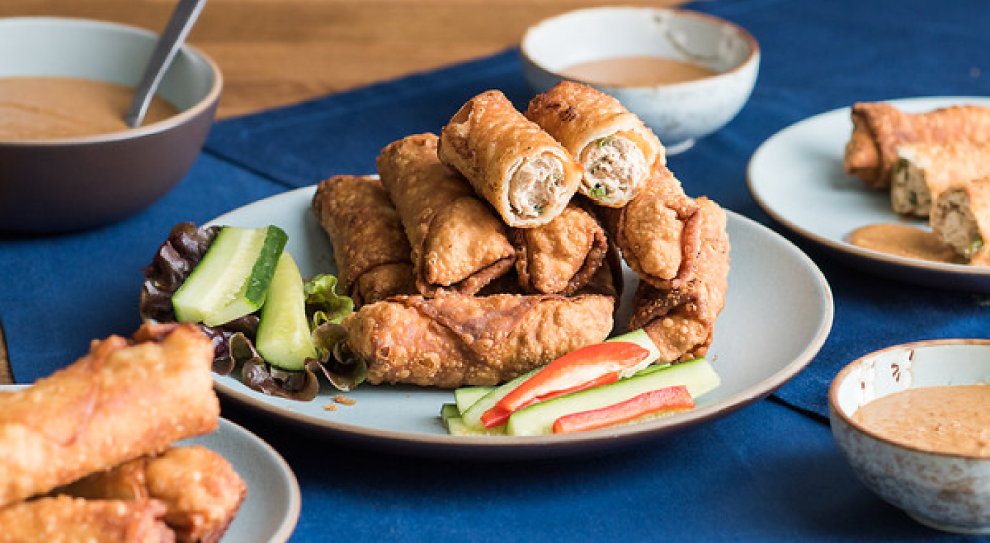 A plate of eggrolls containing minced chicken