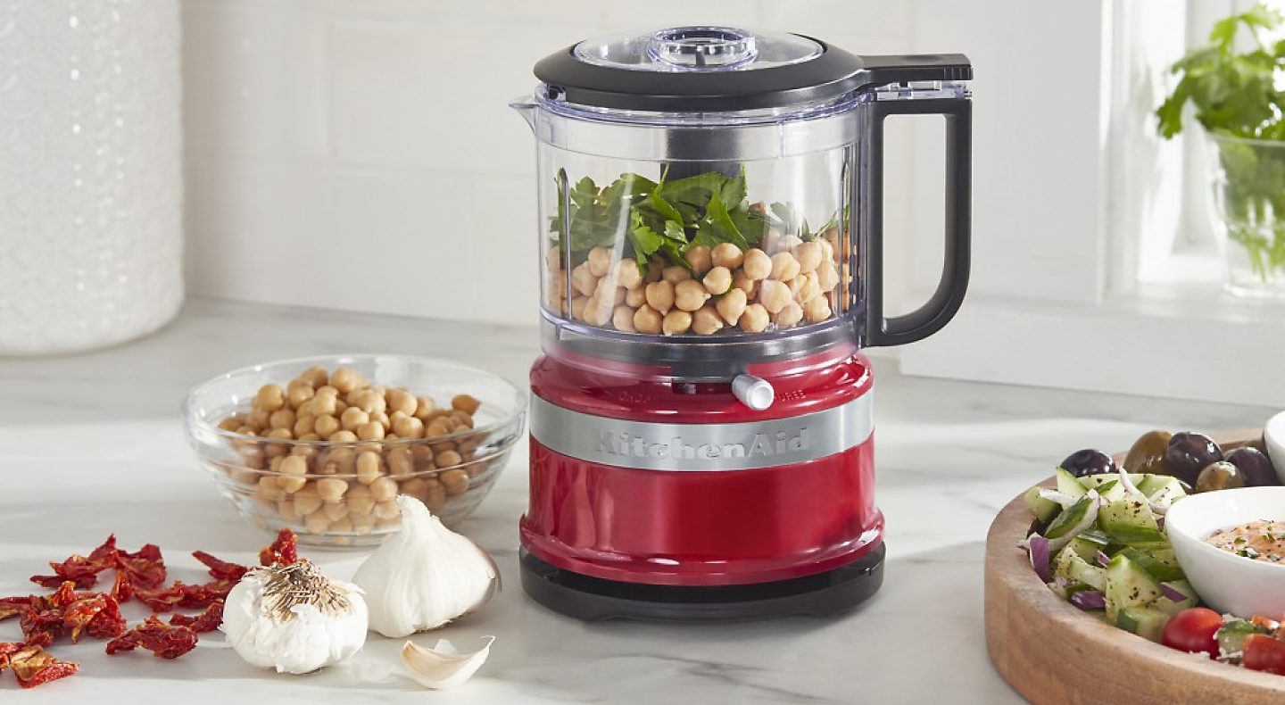 KitchenAid® food processor with chickpeas, fresh herbs, sundried tomatoes and garlic.