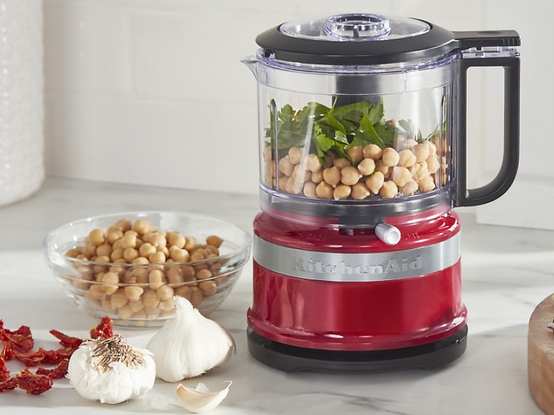KitchenAid® food processor with chickpeas, fresh herbs, sundried tomatoes and garlic.
