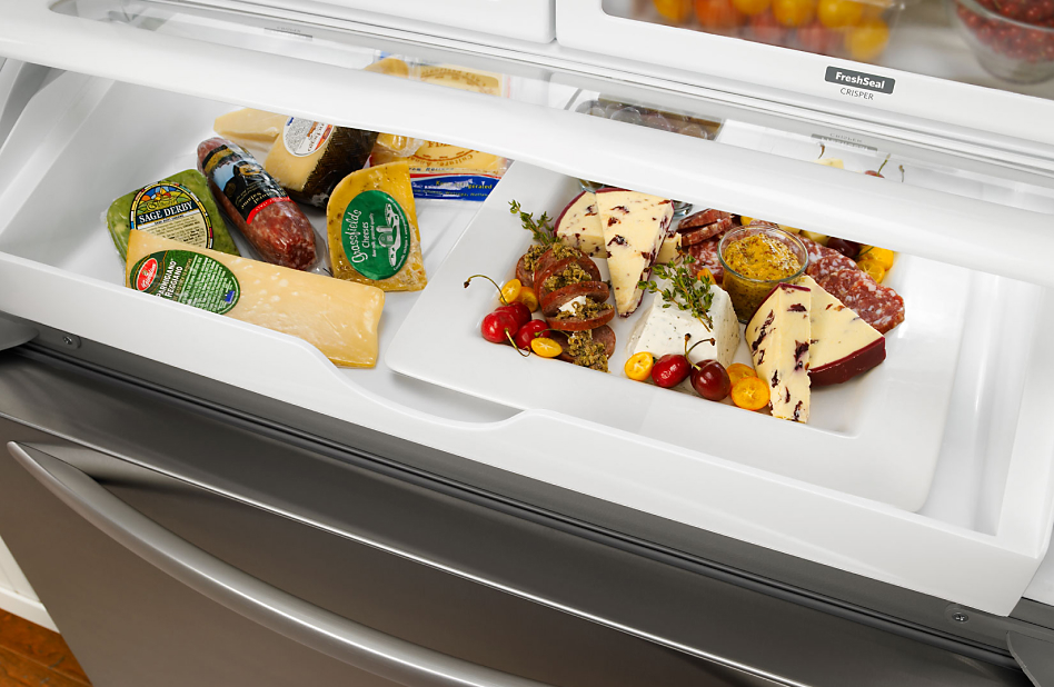 Various meats and cheeses stored in deli drawers Various meats and cheeses stored in deli drawers