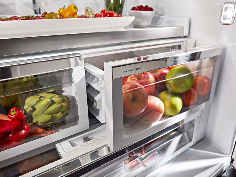 Fruits and vegetables stored in refrigerator crisper drawers 