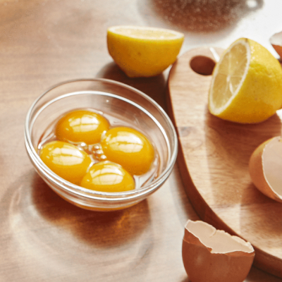 Four eggs in a small glass bowl
