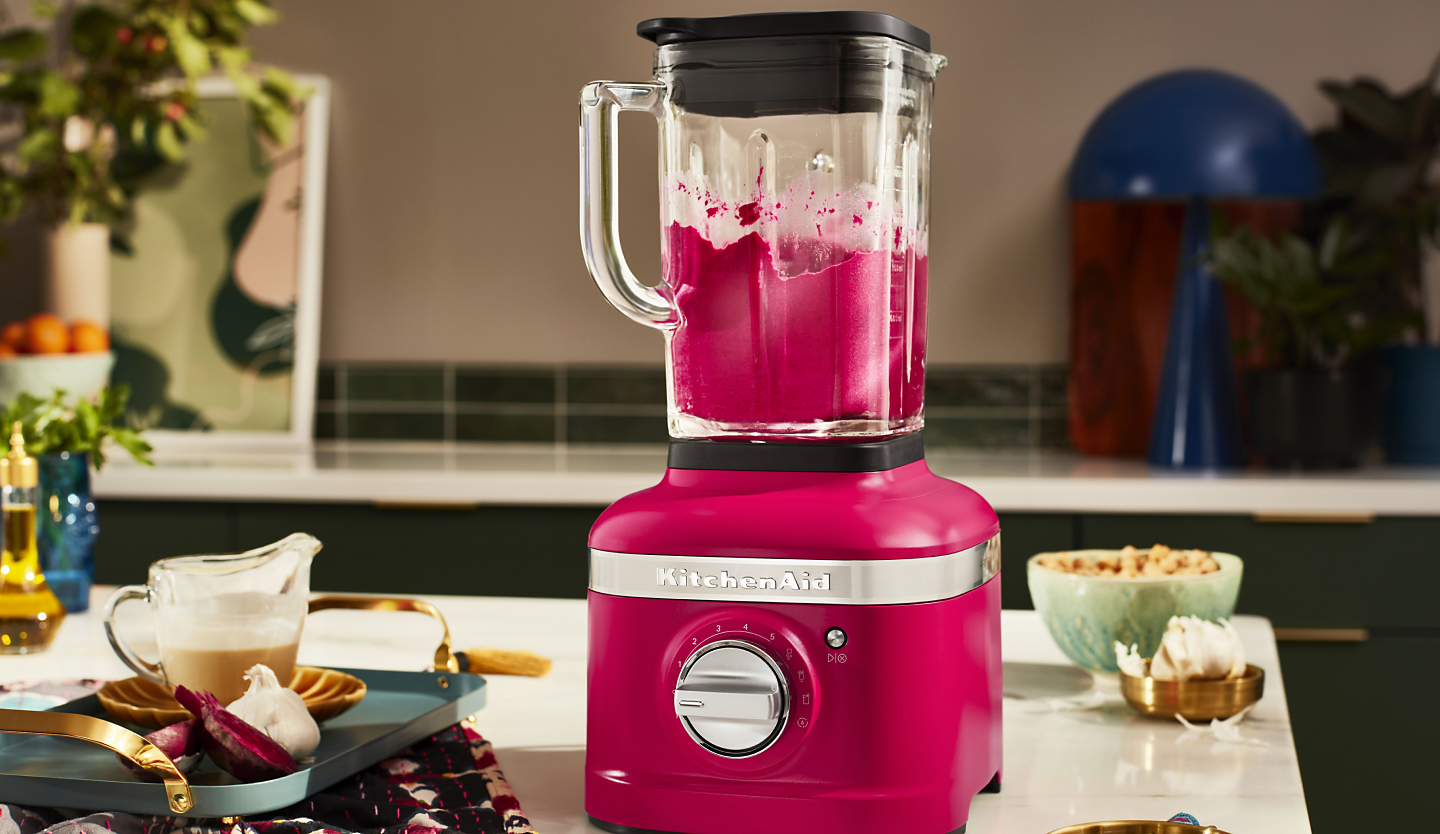 Hibiscus KitchenAid® blender next to various ingredients