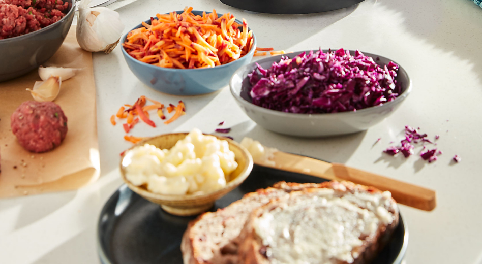 Shredded carrots and cabbage next to buttered toast