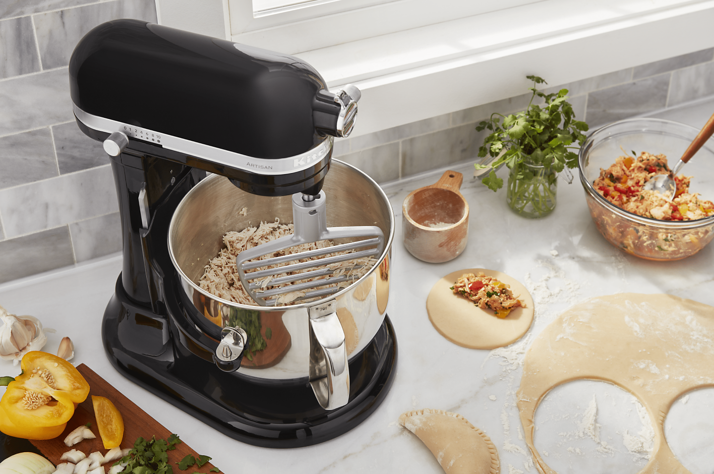 https://kitchenaid-h.assetsadobe.com/is/image/content/dam/business-unit/kitchenaid/en-us/marketing-content/site-assets/page-content/pinch-of-help/how-to-shred-chicken-in-a-stand-mixer/Shred-Chicken_2.png?fmt=png-alpha&qlt=85,0&resMode=sharp2&op_usm=1.75,0.3,2,0&scl=1&constrain=fit,1