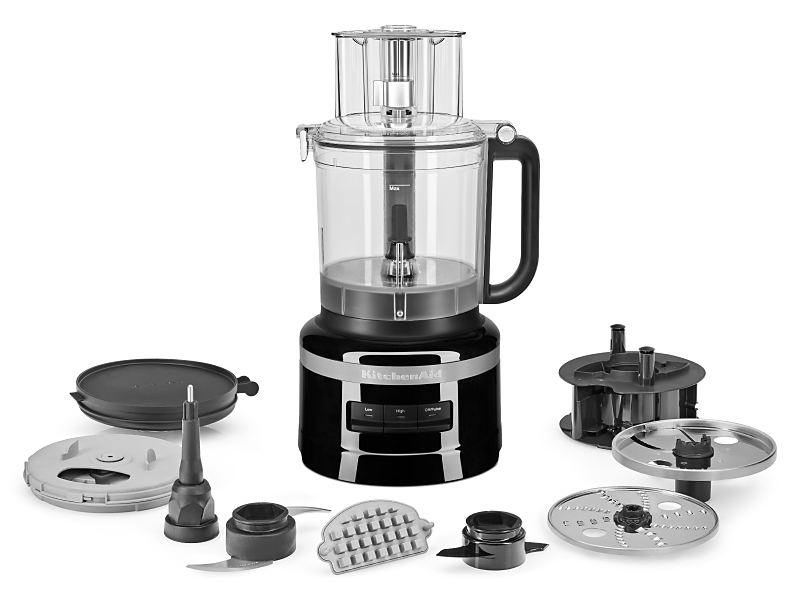 A KitchenAid® food processor with an array of attachments