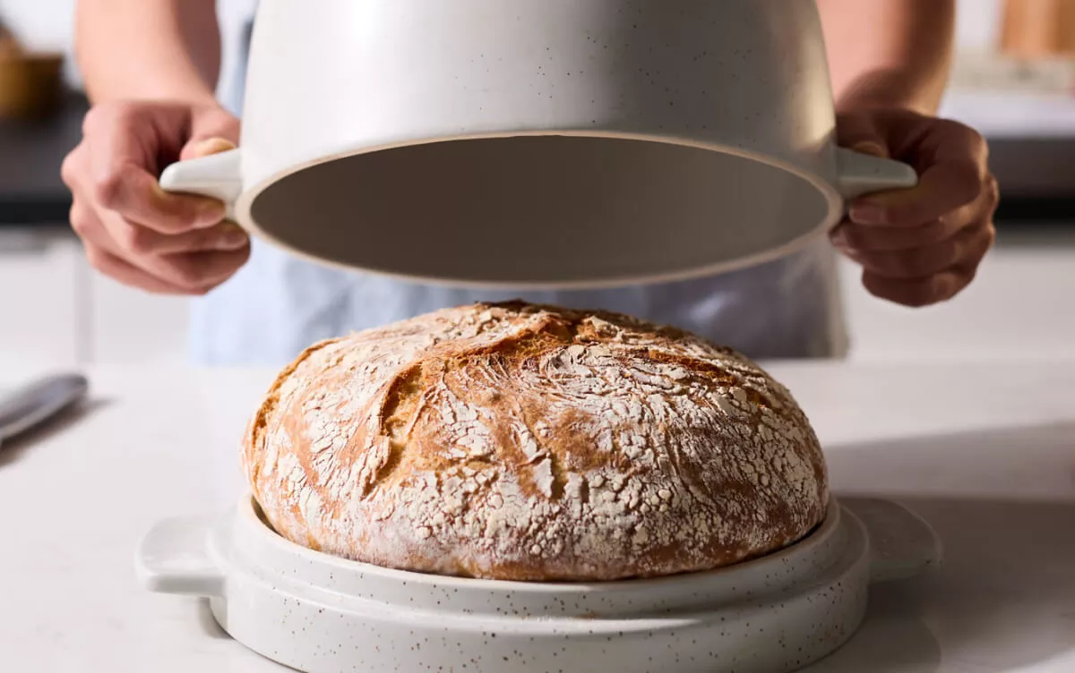 https://kitchenaid-h.assetsadobe.com/is/image/content/dam/business-unit/kitchenaid/en-us/marketing-content/site-assets/page-content/pinch-of-help/how-to-tell-if-bread-is-done-baking/bread-baking-Thumbnail.jpg?wid=1200&fmt=webp