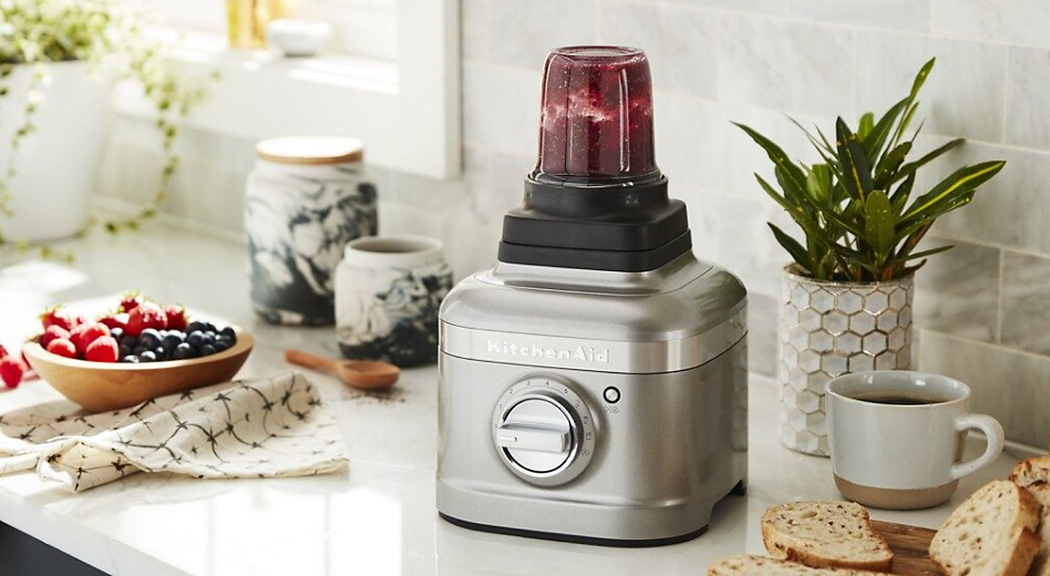 KitchenAid® blender with a personal jar filled with berry mixture