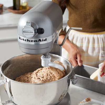 Dough being mixed in a stand mixer bowl.