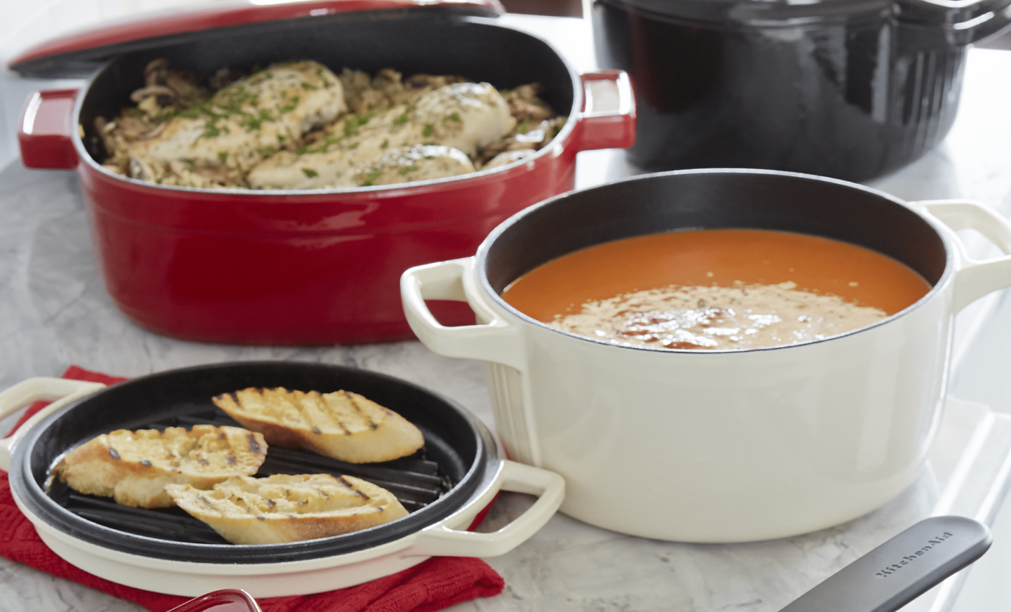 White dutch oven with soup inside