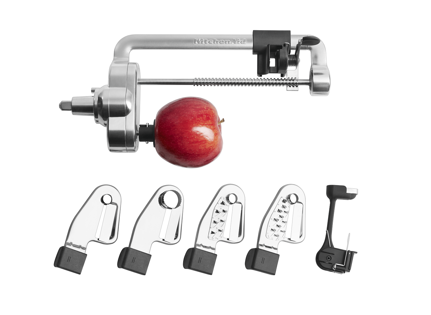 Stand mixer blade attachments and an apple.