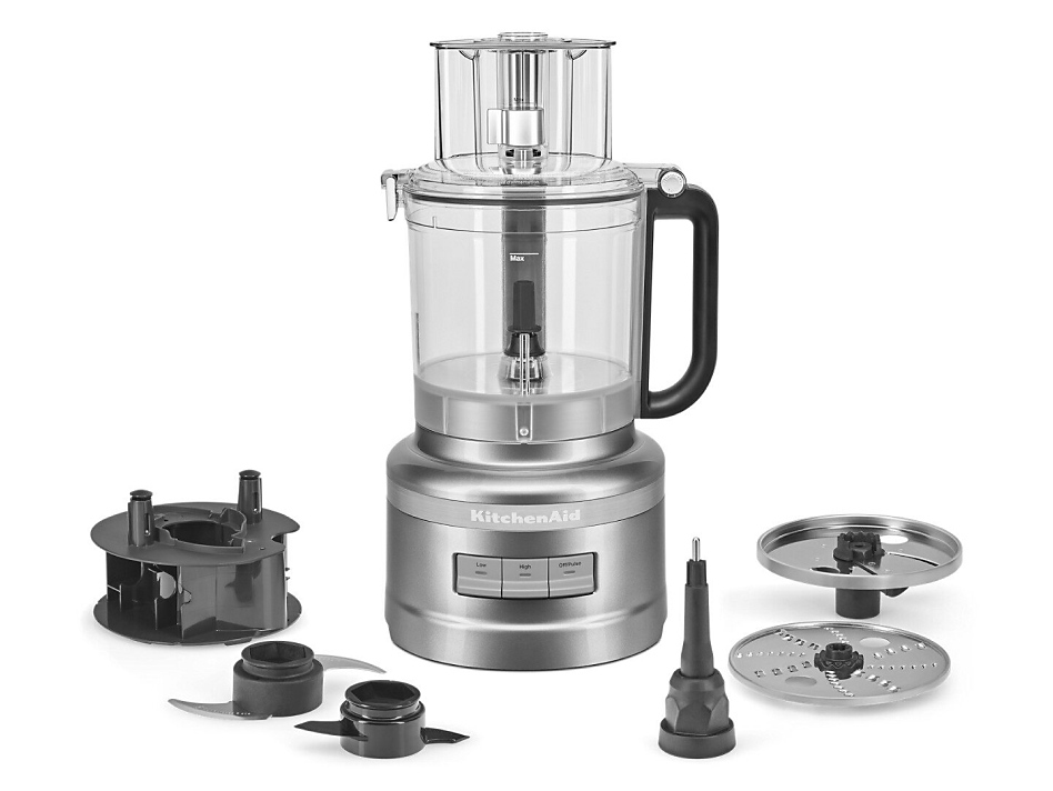 Silver KitchenAid® food processor with different blades and attachments