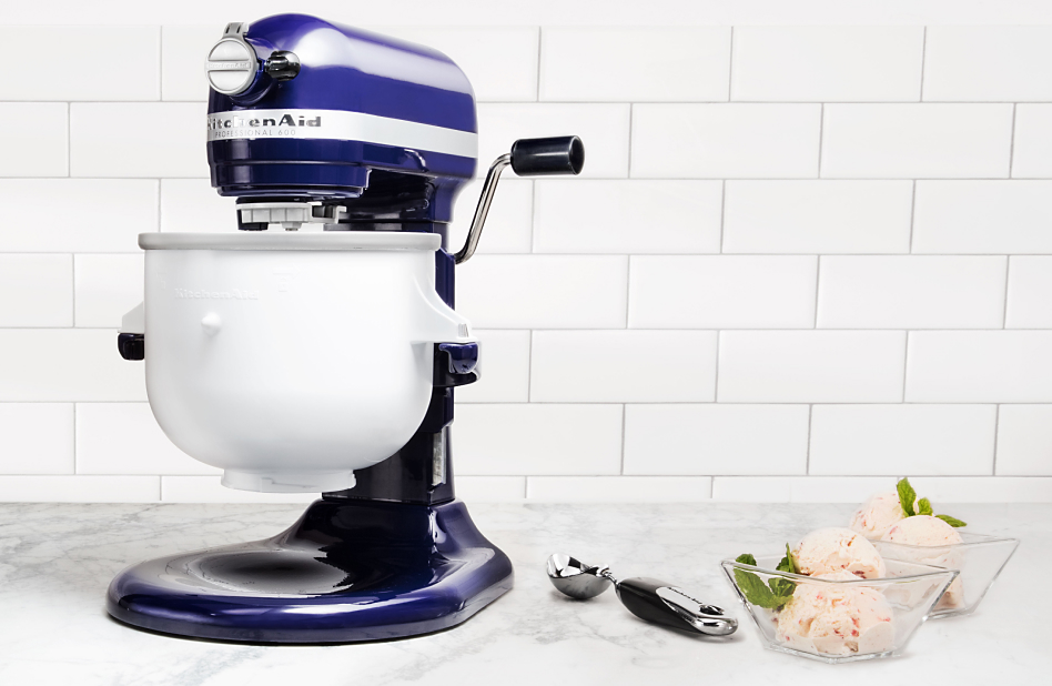 Blue bowl lift stand mixer with Ice Cream Maker attachment on counter