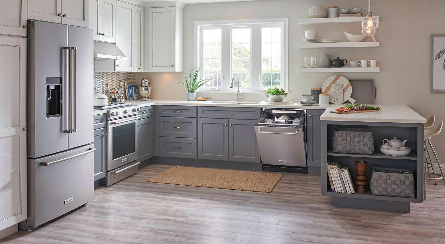 Gray and white kitchen with stainless steel KitchenAid® appliances