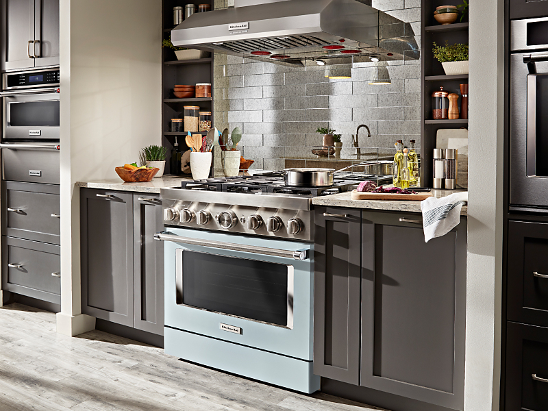 Blue KitchenAid® gas range installed in an updated kitchen