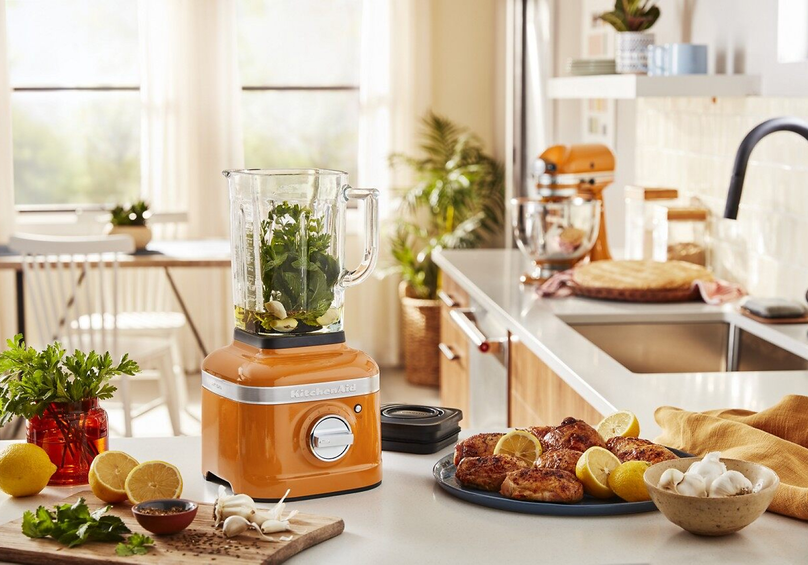 A KitchenAid® blender surrounded by ingredients