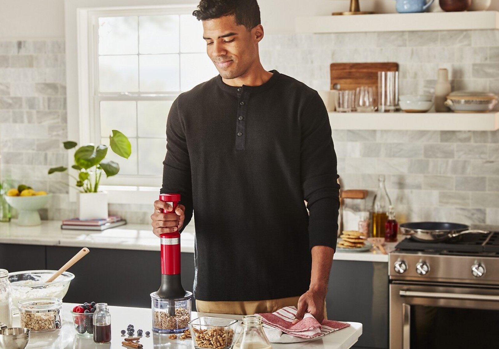 Chopping nuts with a KitchenAid® hand blender accessory.