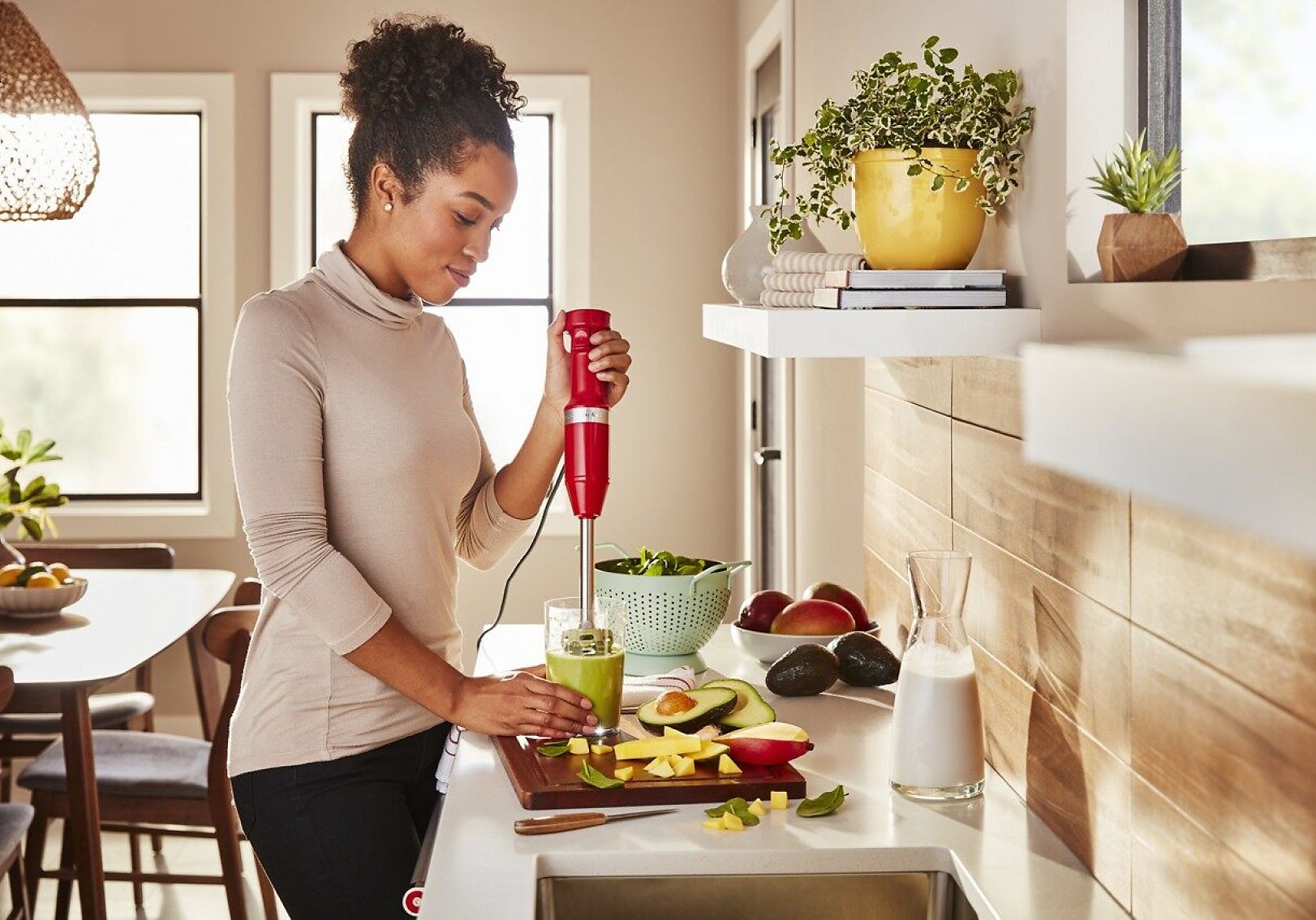 Making an avocado smoothie using a KitchenAid® hand blender.