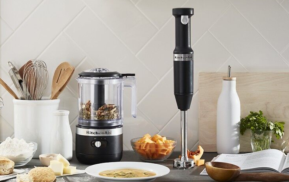 KitchenAid® food chopper and hand blender next to a bowl of soup