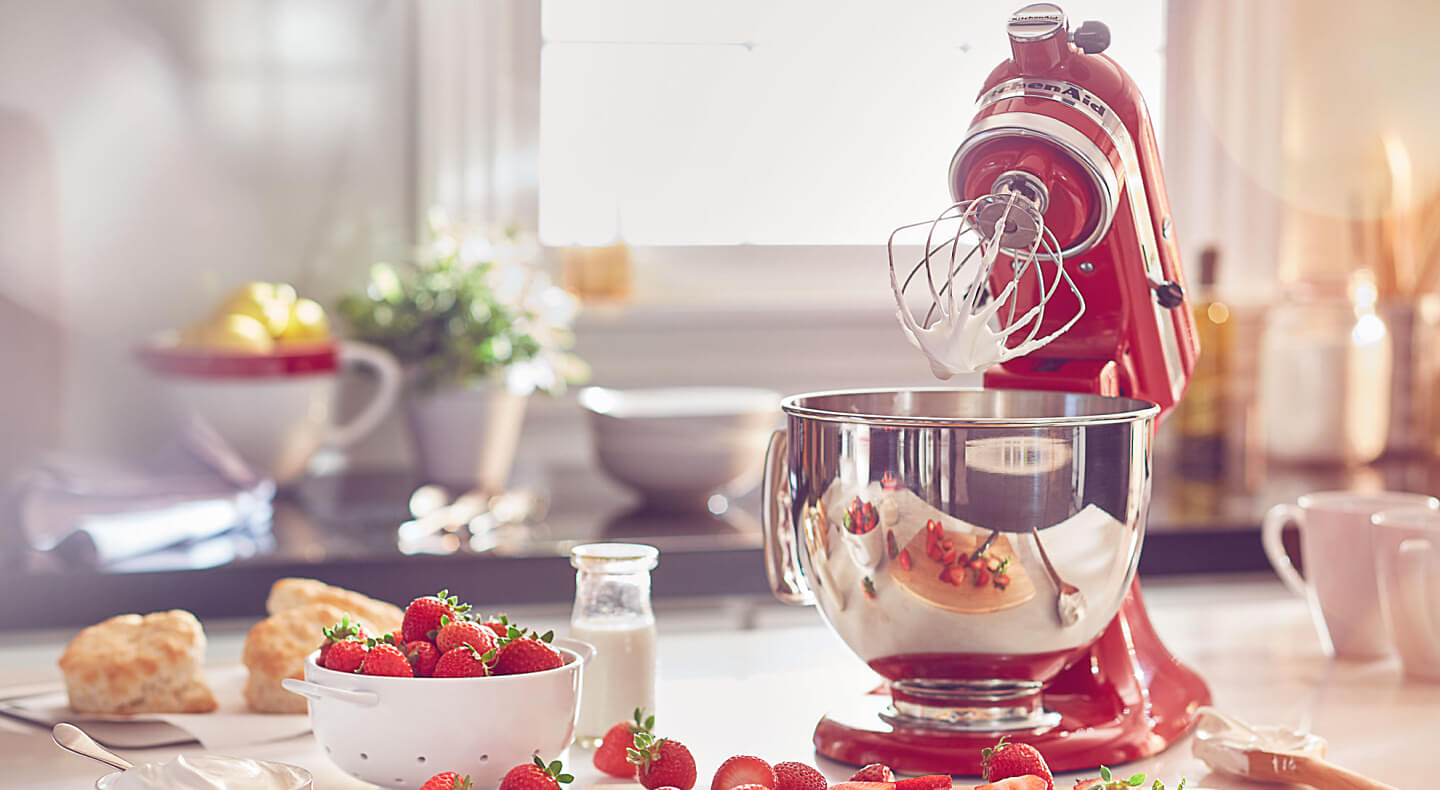 KitchenAid® stand mixer making whipped cream and strawberry shortcake