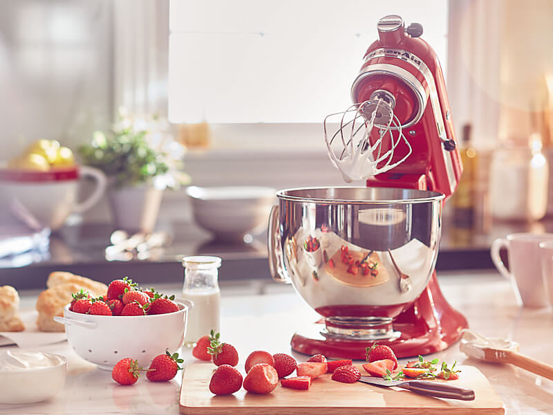 KitchenAid® stand mixer making whipped cream and strawberry shortcake