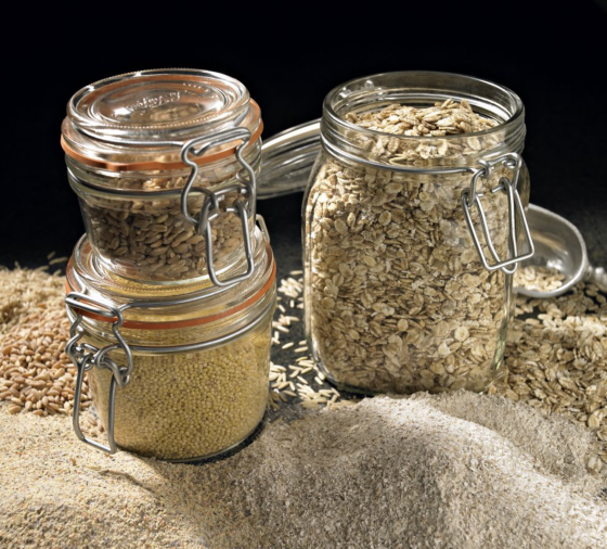 Three jars filled with grains and different spices