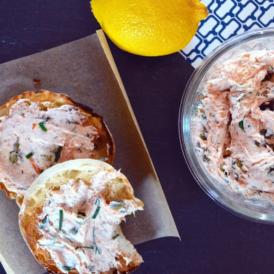 Smoked salmon spread on toasted bagels and a whole lemon