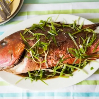 Whole roasted fish on a plate