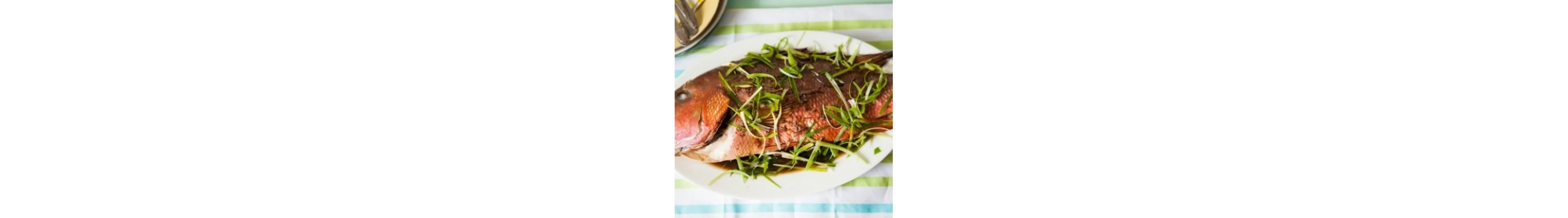 Whole roasted fish on a plate