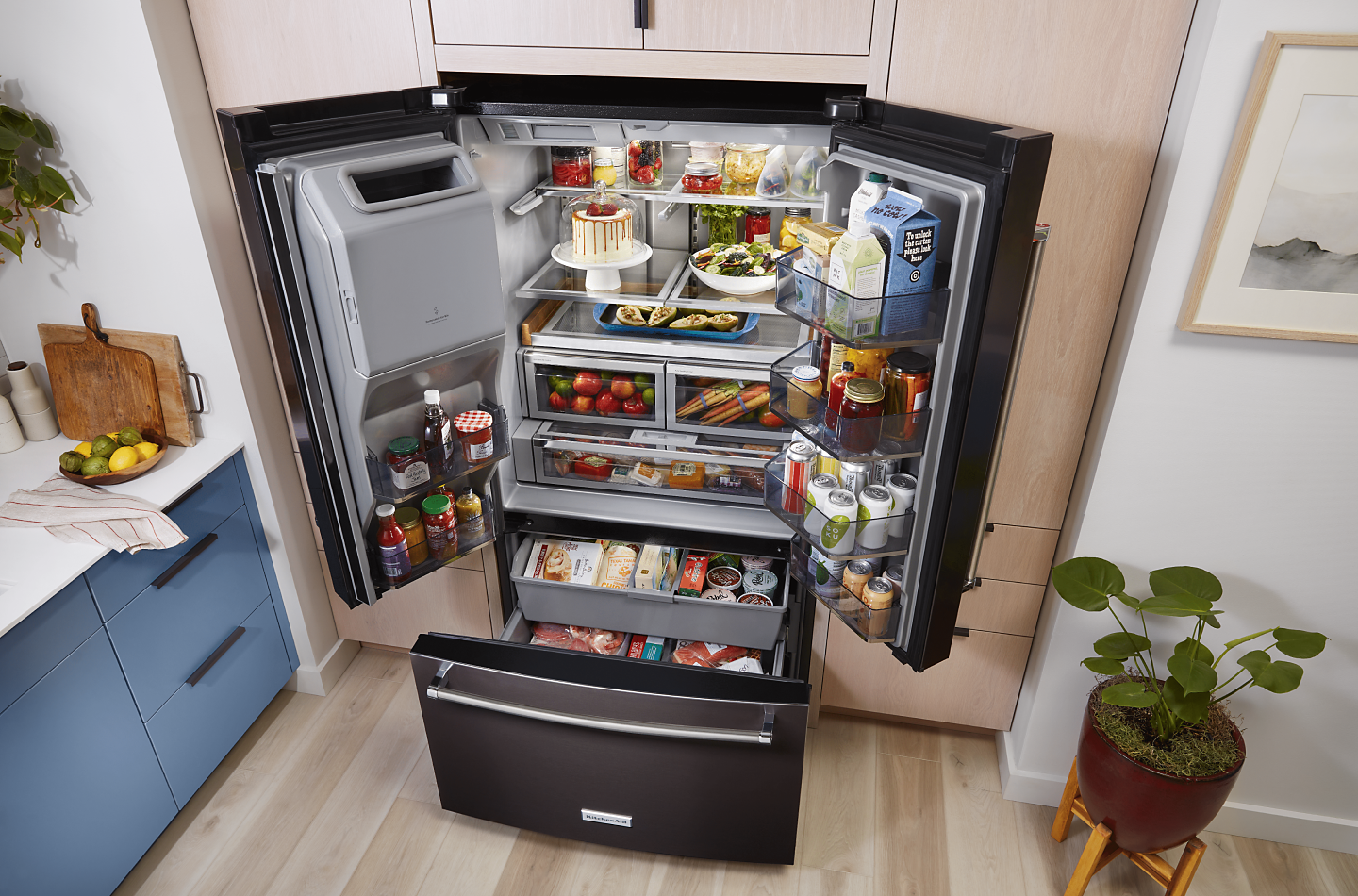 A fully-stocked French Door refrigerator from KitchenAid brand.