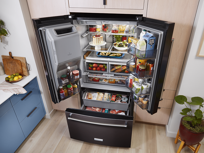 A fully-stocked French Door refrigerator from KitchenAid brand.
