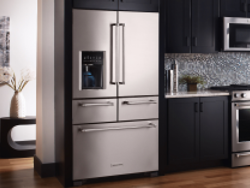 A multi-door KitchenAid® refrigerator in a modern kitchen.