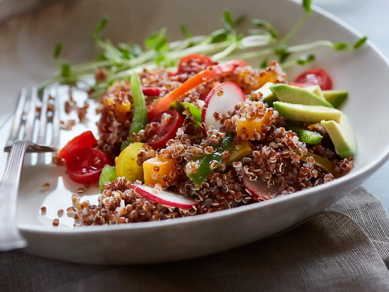Close-up of quinoa salad with fruits and vegetables