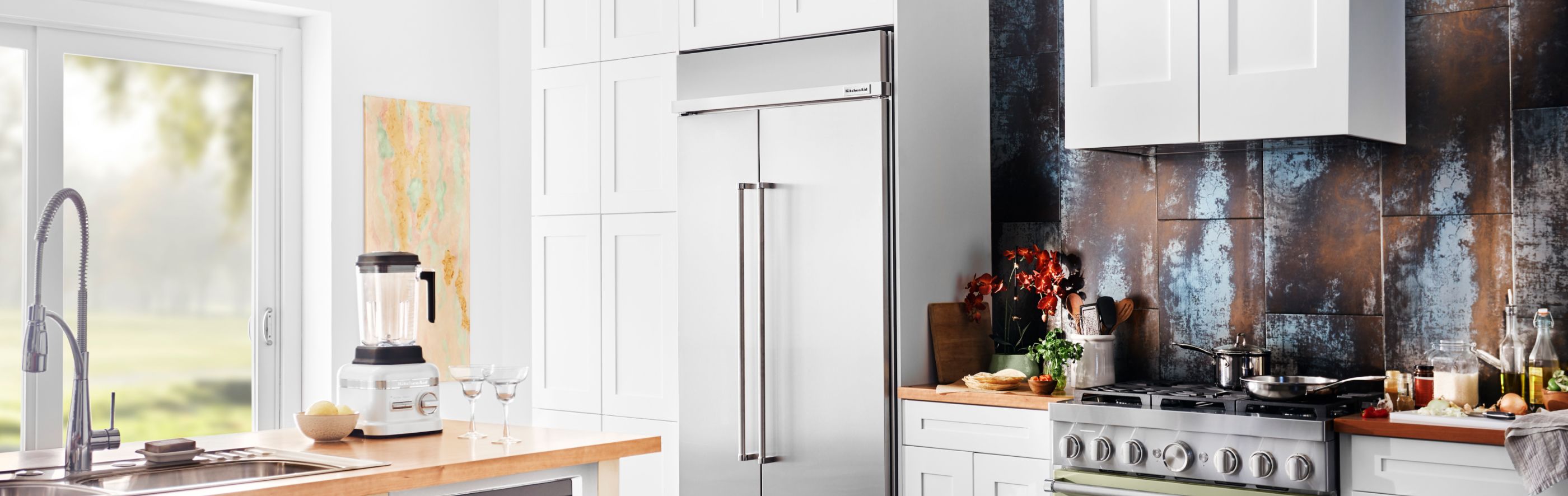 KitchenAid® Side-by-Side Refrigerator in a white kitchen
