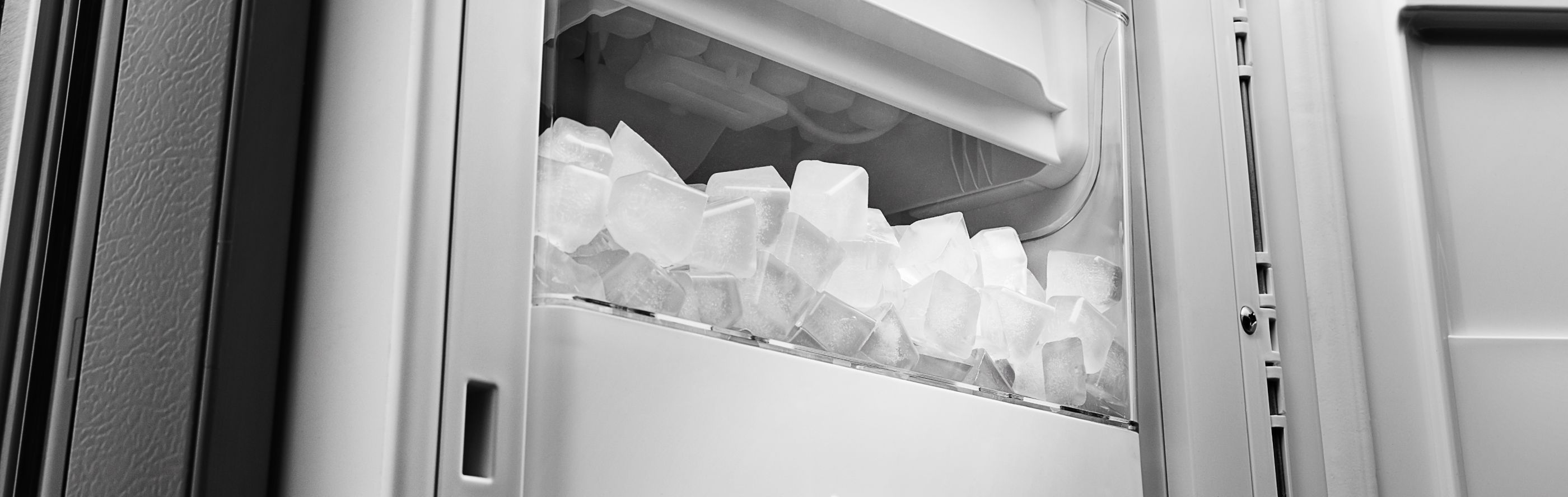 Full ice bin inside refrigerator freezer