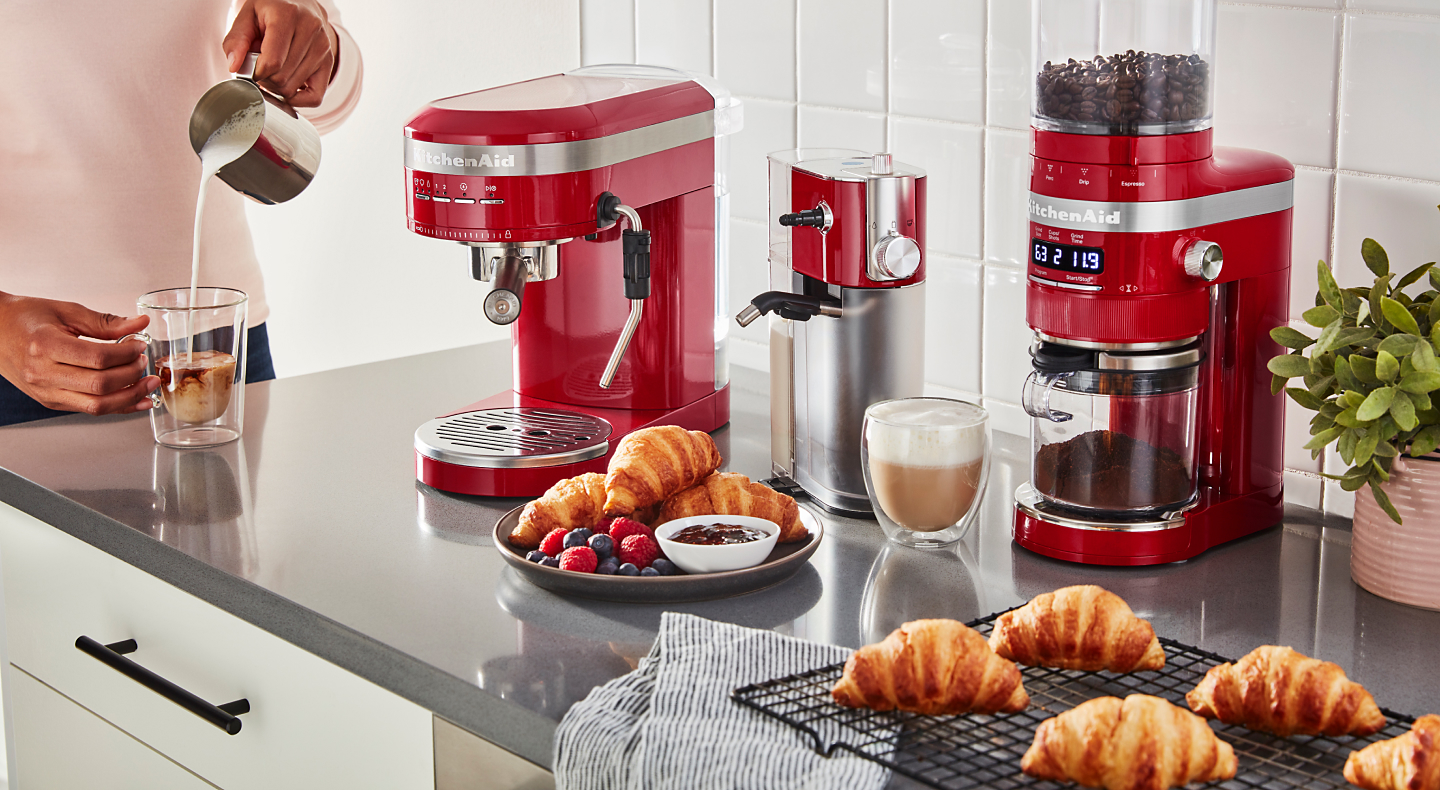 Red KitchenAid® coffee appliances on a countertop