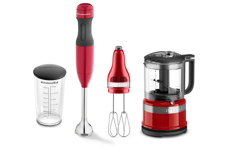 Various red KitchenAid® countertop appliances in a row
