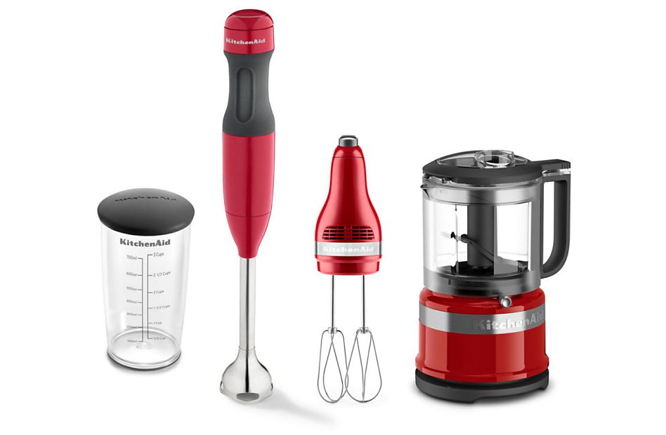 Various red KitchenAid® countertop appliances in a rowSilver food processor shredding red cabbage on counter Various red KitchenAid® countertop appliances in a row