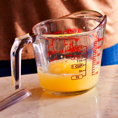  Clarified butter in a glass measuring cup