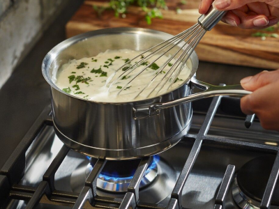 Whisk in saucepan over all-purpose gas burner