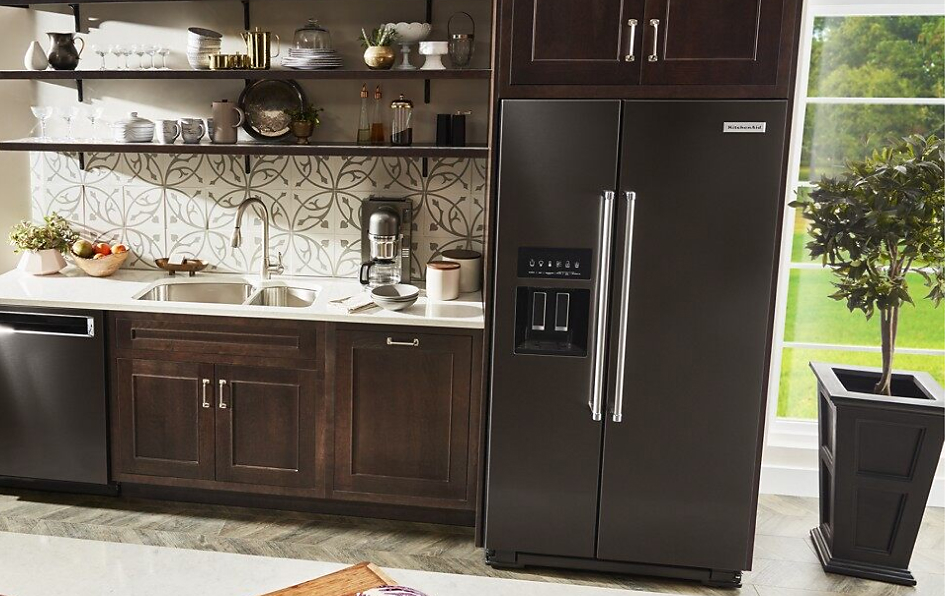 Black stainless steel full-depth refrigerator style in kitchen