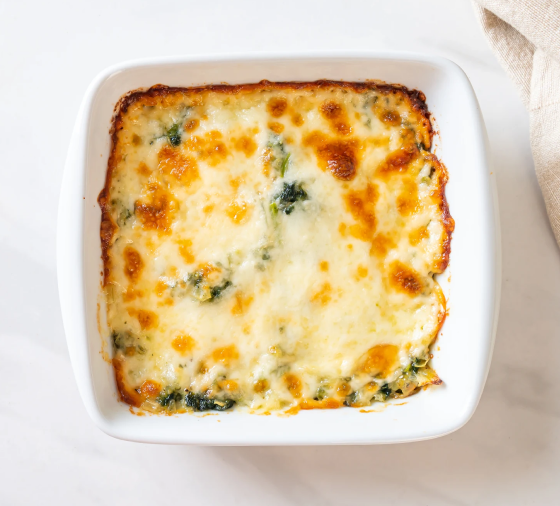 A cheesy-looking dip in a white dish