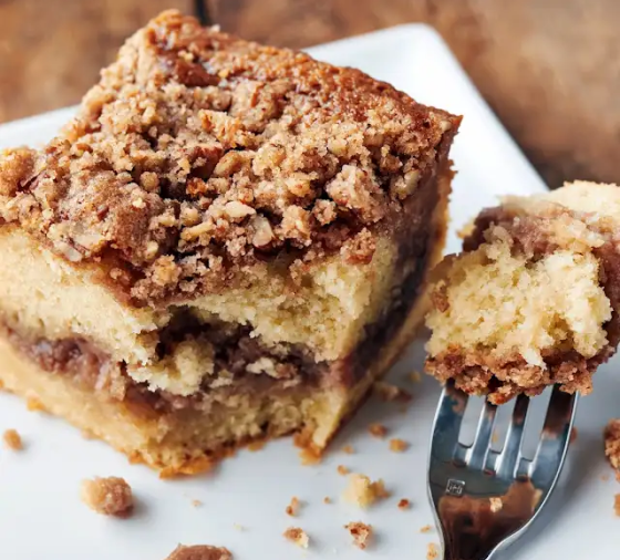 A slice of cake with crumb topping