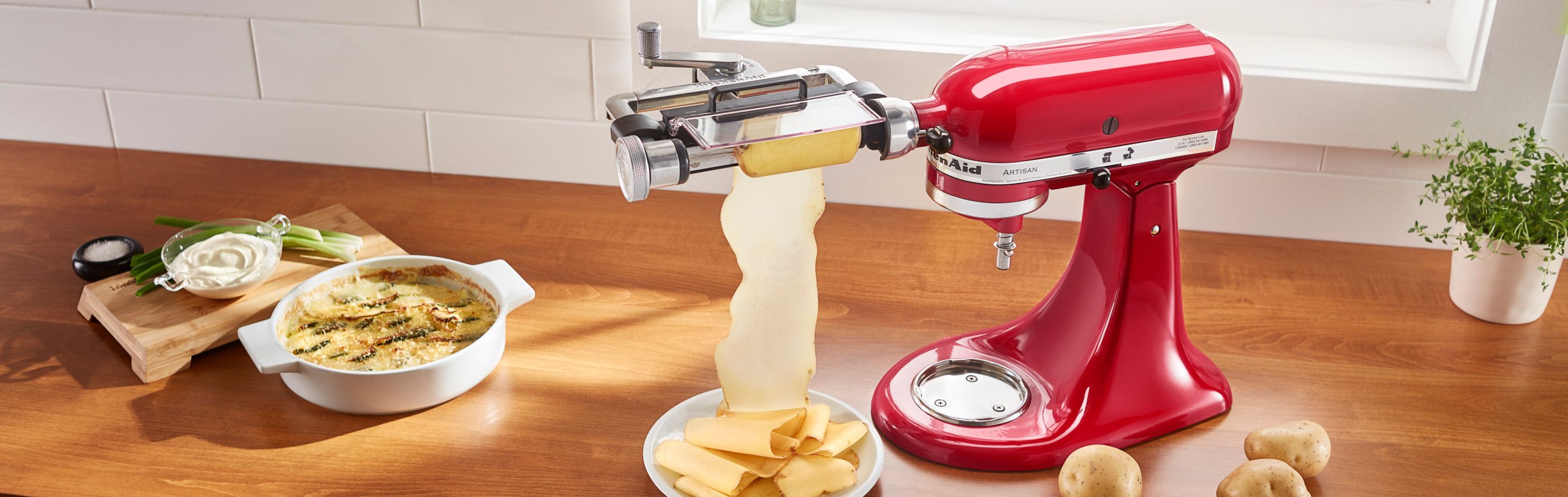 Red KitchenAid® stand mixer with Vegetable Sheet Cutter Attachment