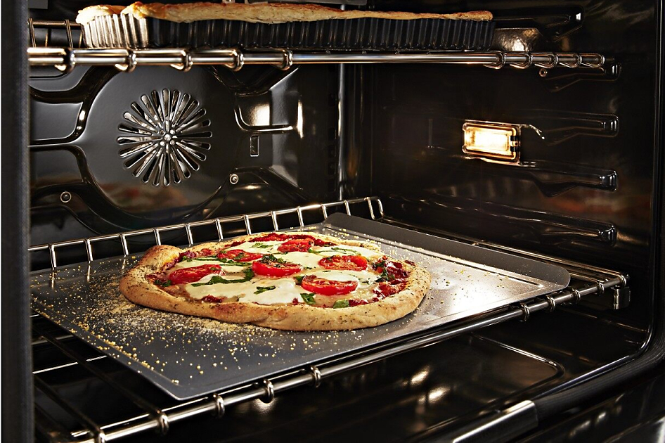 Pizza cooking in a convection oven