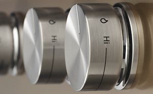 Close-up of kitchen range burner knobs