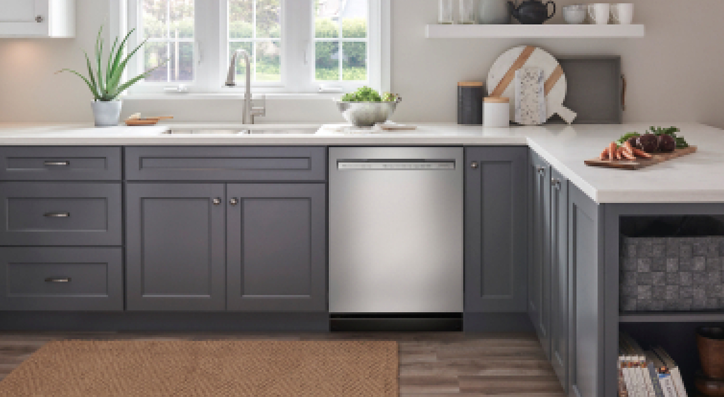 Stainless steel KitchenAid® dishwasher in a grey and white kitchen