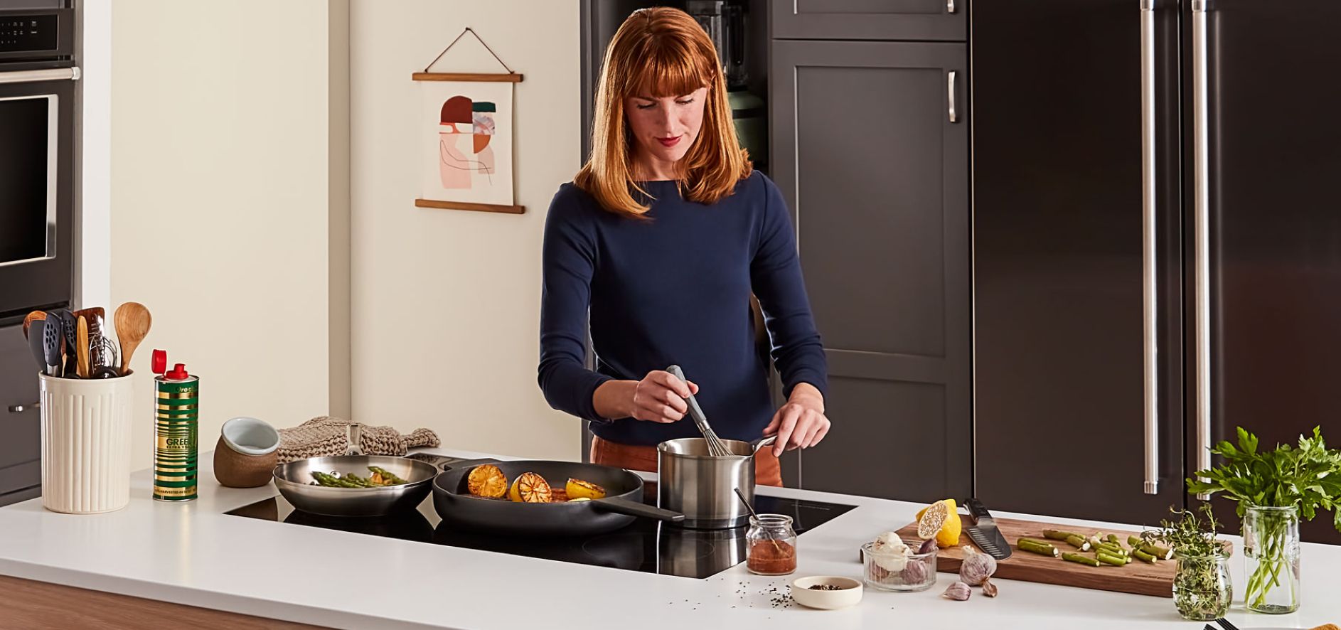 Woman cooking using an induction cooktop