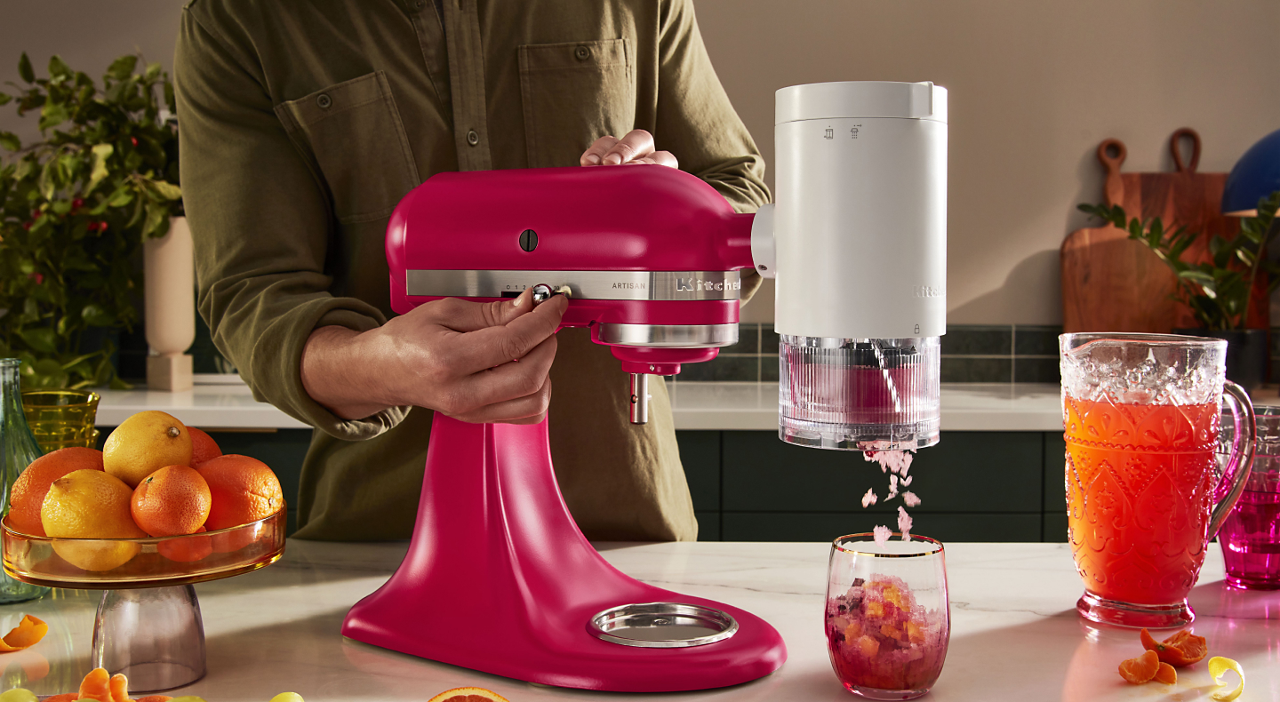 KitchenAid® stand mixer with shave ice attachment making frozen treats